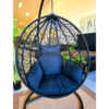 Bird nest single-seater egg chair in black rattan for outdoor relaxation