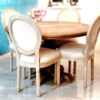 Lifestyle setup image of dining area with French Country beige linen armchair