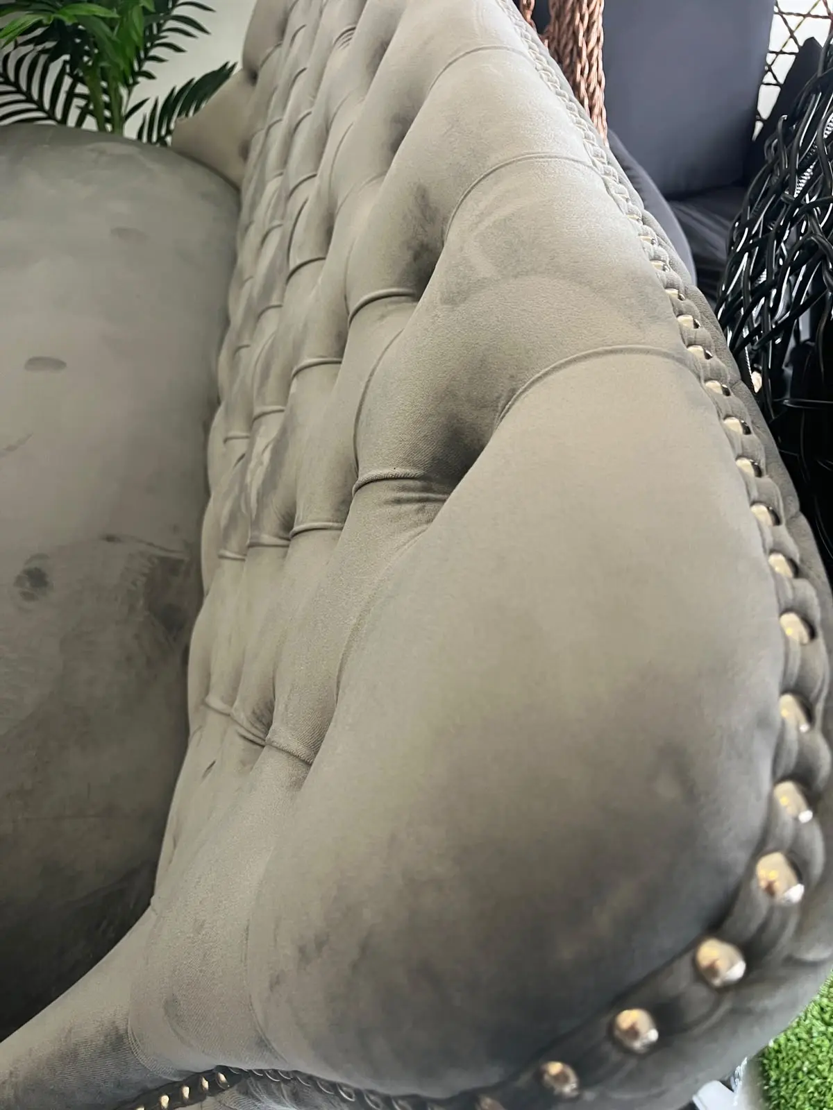 Zara grey velvet dining bench with curved wingback and metallic nailhead trim