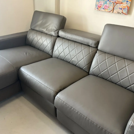 Zoe grey leather lounge with padded seating and electric recliner